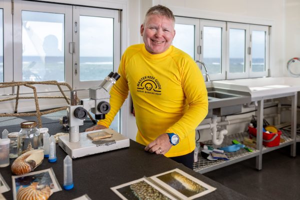 GBR Biology Manager Eric Fisher in the laboratory on the Reef Magic Pontoon at Moore Reef on the Great Barrier Reef. Image Luke Marsden